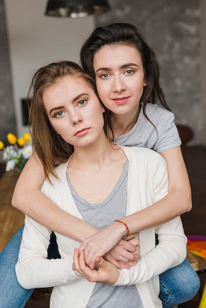 Free Photo Portrait Of A Young Romantic Lesbian Couple Looking At Camera