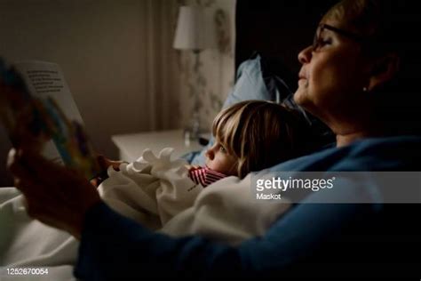 Grandmother Reading To Grandson Photos And Premium High Res Pictures