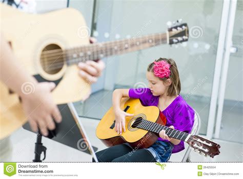 guitar lesson stock photo image  focus practicing