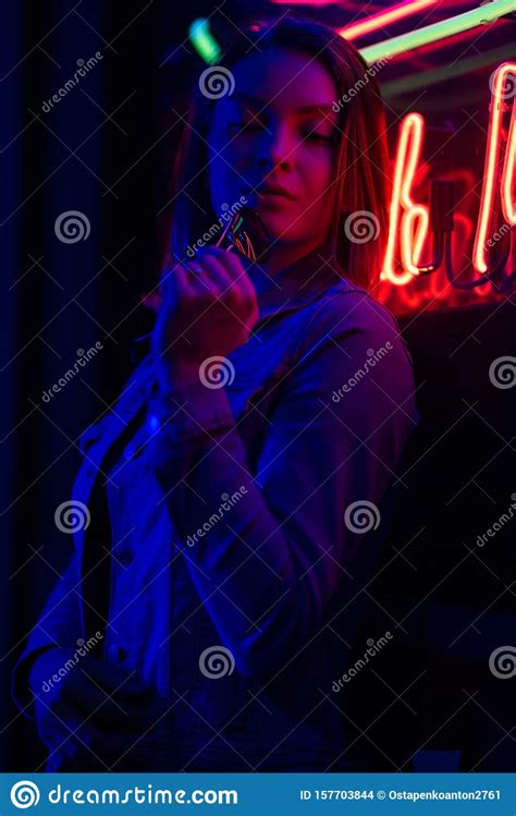 Creative Sexual Portrait Of A Girl In Neon Lighting With