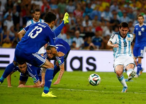 argentina s lionel messi scores a goal during the 2014 world cup group