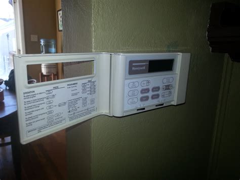 older programmable honeywell thermostat   cover  swings   access