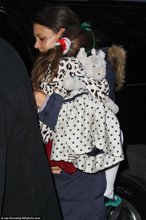 katie holmes cuddles sleepy suri ahead of a play date with her new