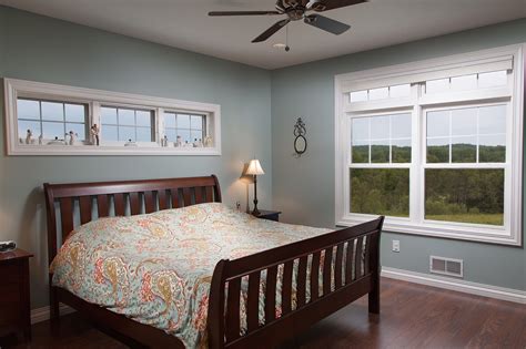 bedroom   tall ceiling   awning windows   bed home oak laminate flooring