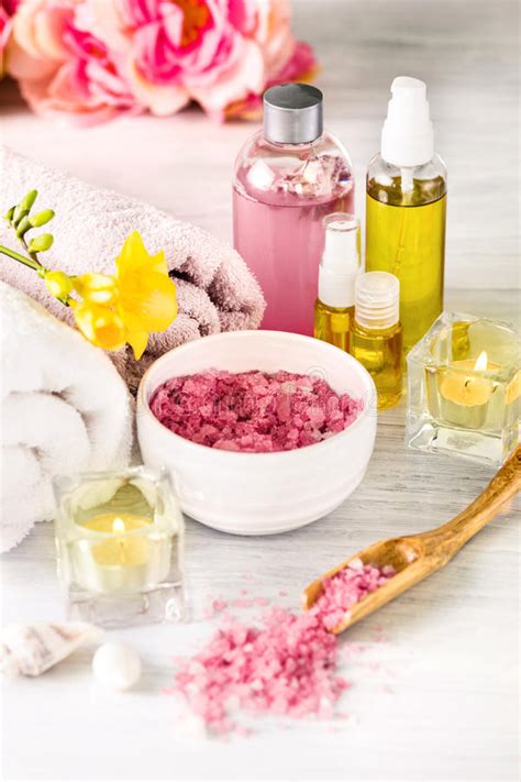 spa setting  pink roses  aroma oil vintage style stock image