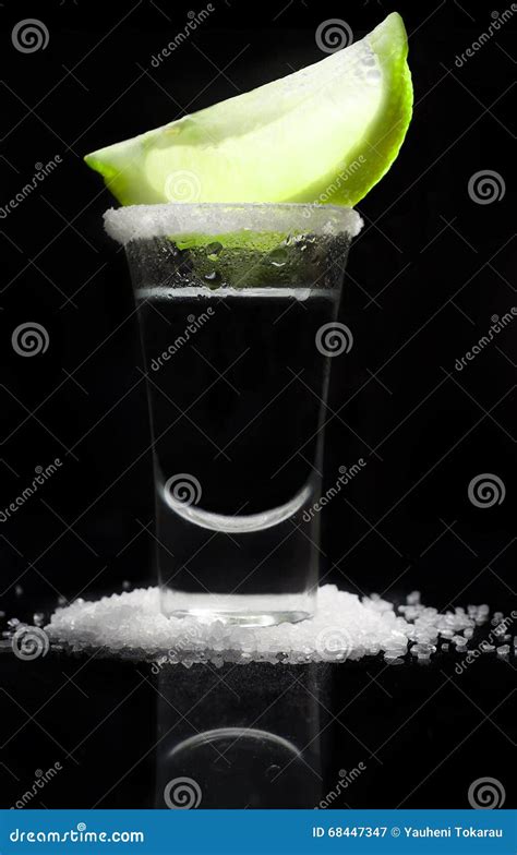 tequilla   glass   reflective black background stock image