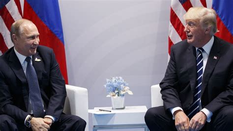 watch grins handshakes as trump meets putin for first
