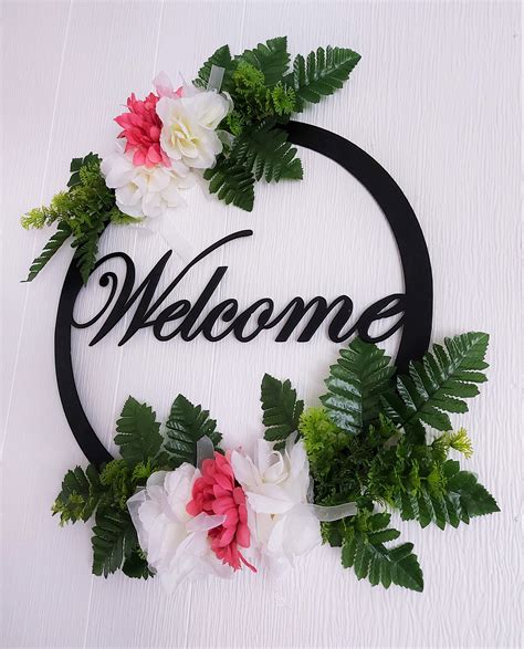 sign  metal frame  flower decorations  wreath