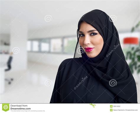 arabian woman posing in a business center stock
