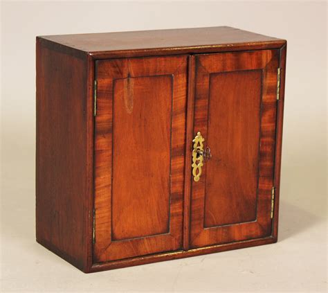 a good george iii mahogany table top cabinet fitted with two panelled