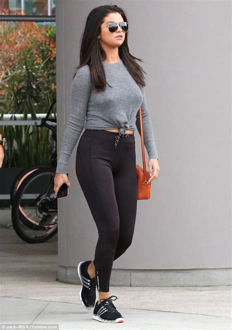 selena gomez shows off her toned pins in skintight leggings in la daily mail online