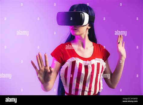 European Model With Long Hair And Vr Glasses Is Rising Her Hands Medium