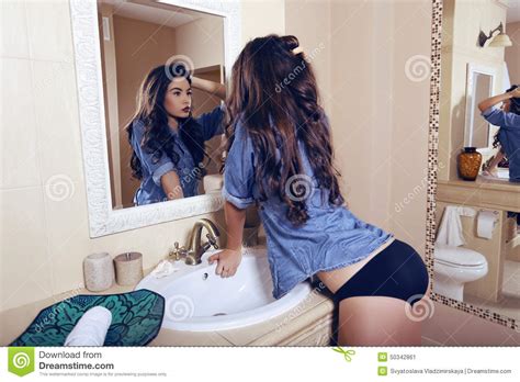 Girl Wearing Lingerie And Jeans Shirt Posing In Bathroom