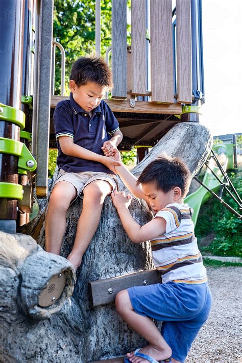 asian kids helping     playground  stocksy contributor   pix media