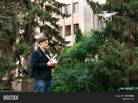 young man flying drone image photo  trial bigstock