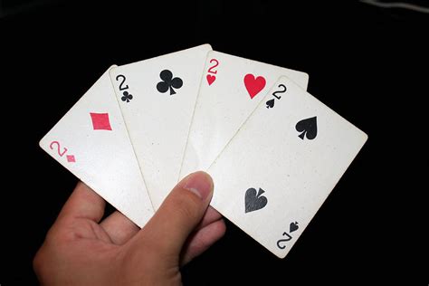 cards  stock photo  hand holding   twos   standard