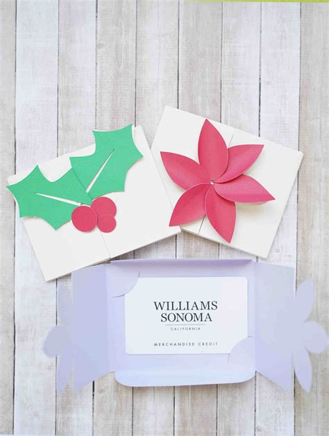 folded christmas cards  holly leaves  poinsettis