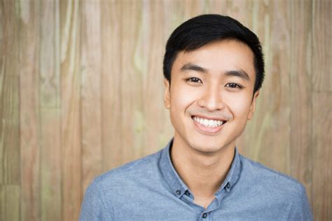 Closeup Portrait Of Smiling Handsome Asian Man Homebase Vietnam
