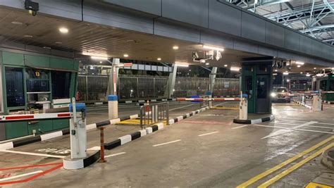 midnight queues  quiet  morning  woodlands checkpoint