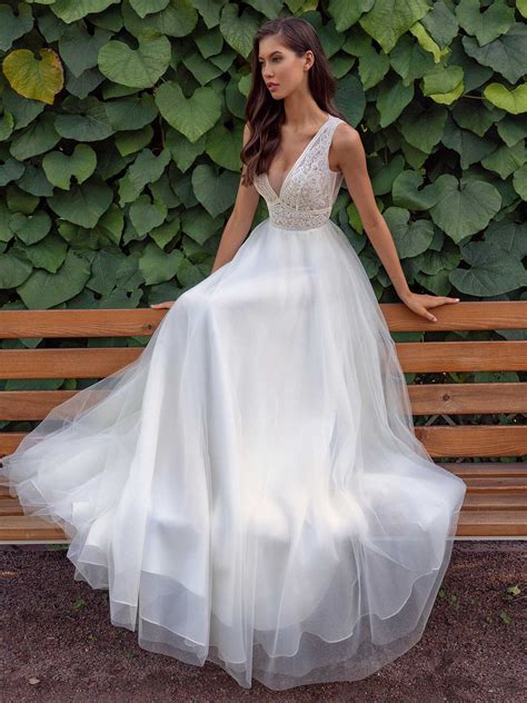 wedding dress   deep  neckline lace bodice  illusion