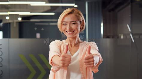Cheerful Lively Blonde Girl Dances Beautifully In Office Showing Ok