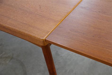 midcentury teak extendable dining table by henning kjærnulf denmark