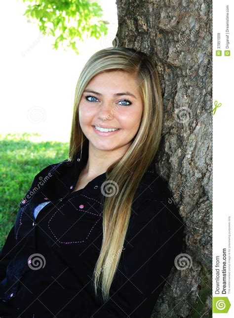 pretty blonde high school senior girl outdoor royalty free