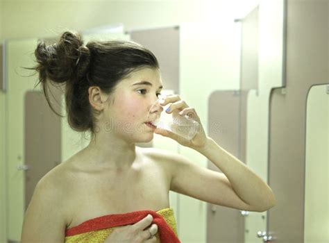 Teenager Girl With Towel And Water Glass After Shower Stock Image