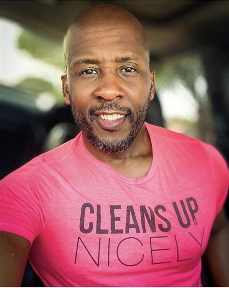 A Man Wearing A Pink Shirt With The Words Cleans Up Nicely On It