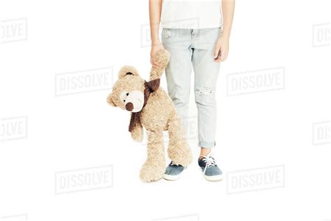 cropped image  child holding teddy bear isolated  white stock