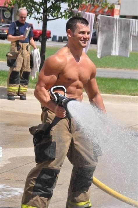 Sexy Shirtless Muscle Man Firefighter Spraying His Hose