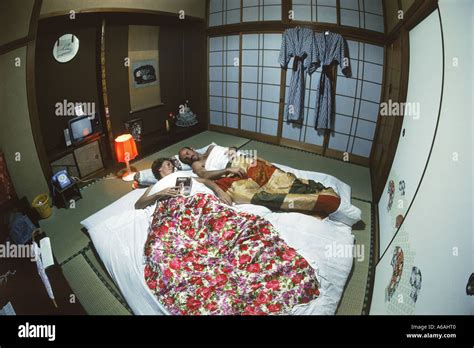 Couple Sleeping On Futon In Typical Japanese Home Or Japanese Style Bed