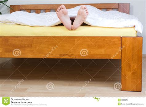 feet sticking out from blanket stock image image 7638471