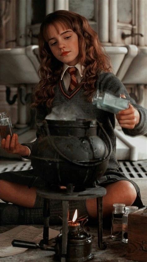 Emma Watson As Hermione Granger Sitting On The Floor Preparing