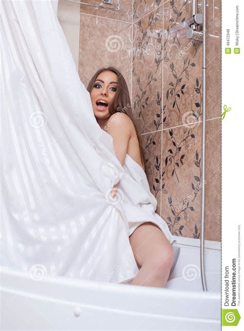 Image Of Pretty Woman Hiding Behind Shower Curtain Stock