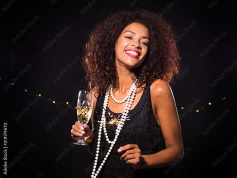 Sexy Black Afro Woman In Evening Dress Standing While New Years Party