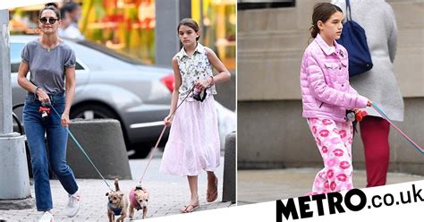 Suri Cruise Is Pretty In Pink As She Walks Her Two Pooches In New York