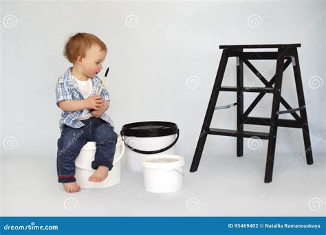 children sit  large cans  paint stock photo image  girl