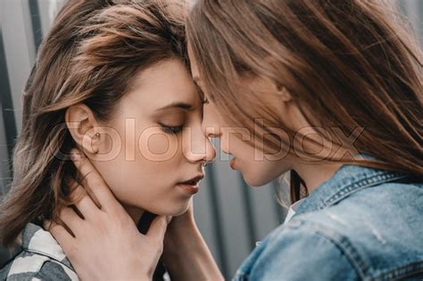 Close Up Portrait Of Beautiful Sensual Girlfriends Hugging
