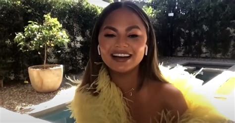 chrissy teigen shrugs off topless pic with 2 year old son wait til