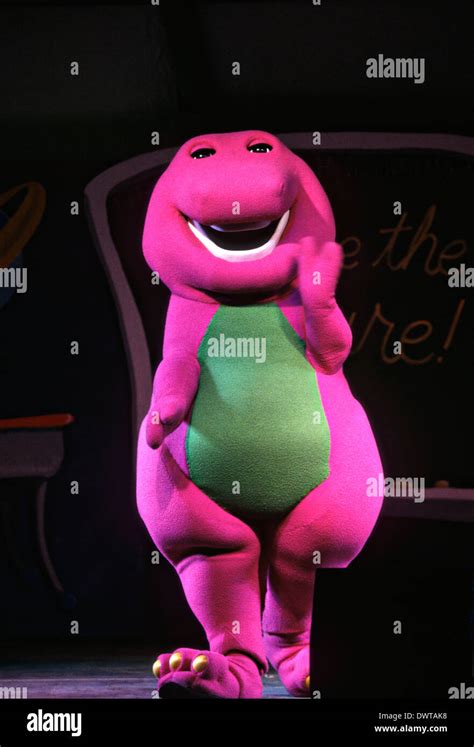 popular childrens character barney  purple dinosaur performs