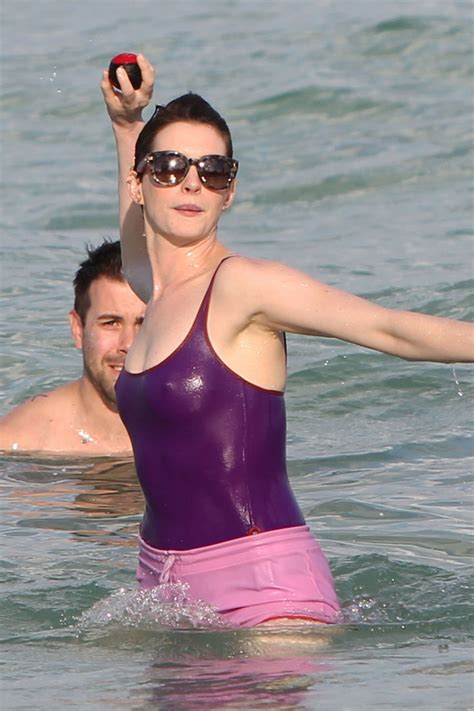 Anne Hathaway In A Swimsuit And Shorts At A Beach In Miami March 2014