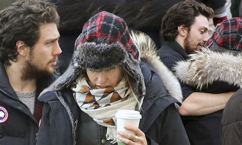 aaron taylor johnson 23 keeps wife sam 46 warm as he visits her on