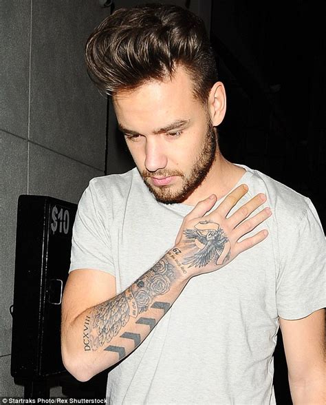 directions liam payne shows  huge  lion tattoo