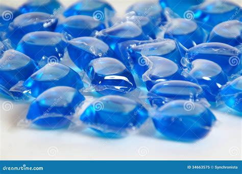 blue liquid laundry detergent pods royalty  stock photo image