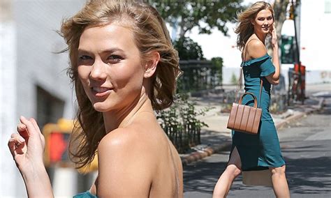Karlie Kloss In A Teal Off The Shoulder Dress As She Grabs A Health