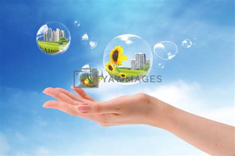 royalty  image hands holding bubbles   blue sky  rufous