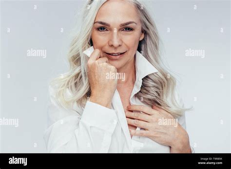 Attractive Mature Woman Posing Against White Background Senior Woman