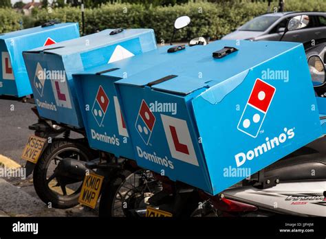 dominos pizza delivery motor scooters stock photo alamy