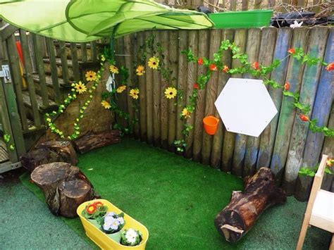 eyfs reading area nook logs turf artificial flowers play area